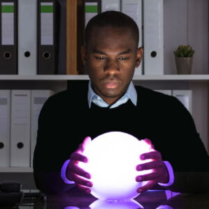 man looking into a crystal ball